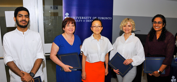 2023 Mary Choi Staff Excellence Award winners with Dean Laura Tam