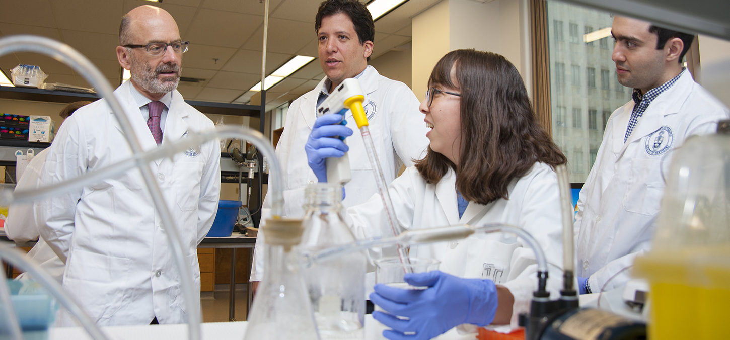 image of dean d. haas, prof marco magalhaes and students