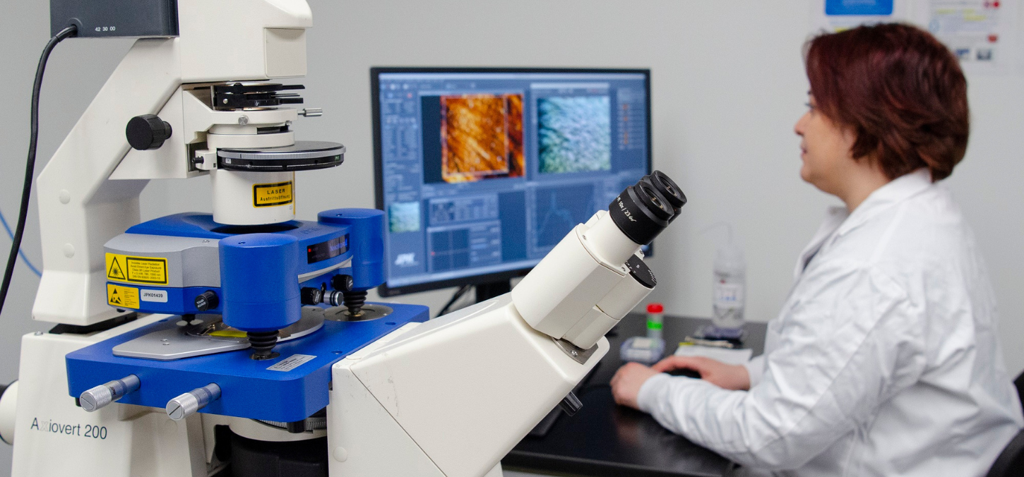 researcher using atomic force microscope