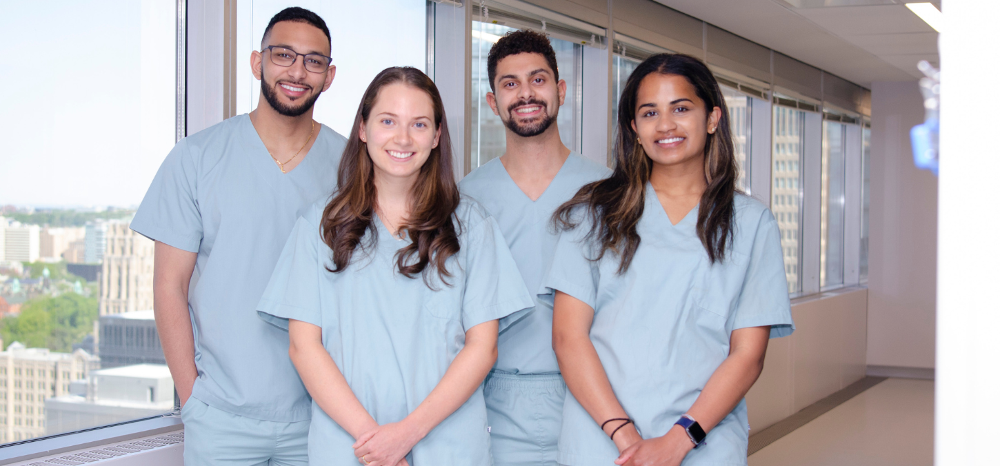 four dental students smiling 