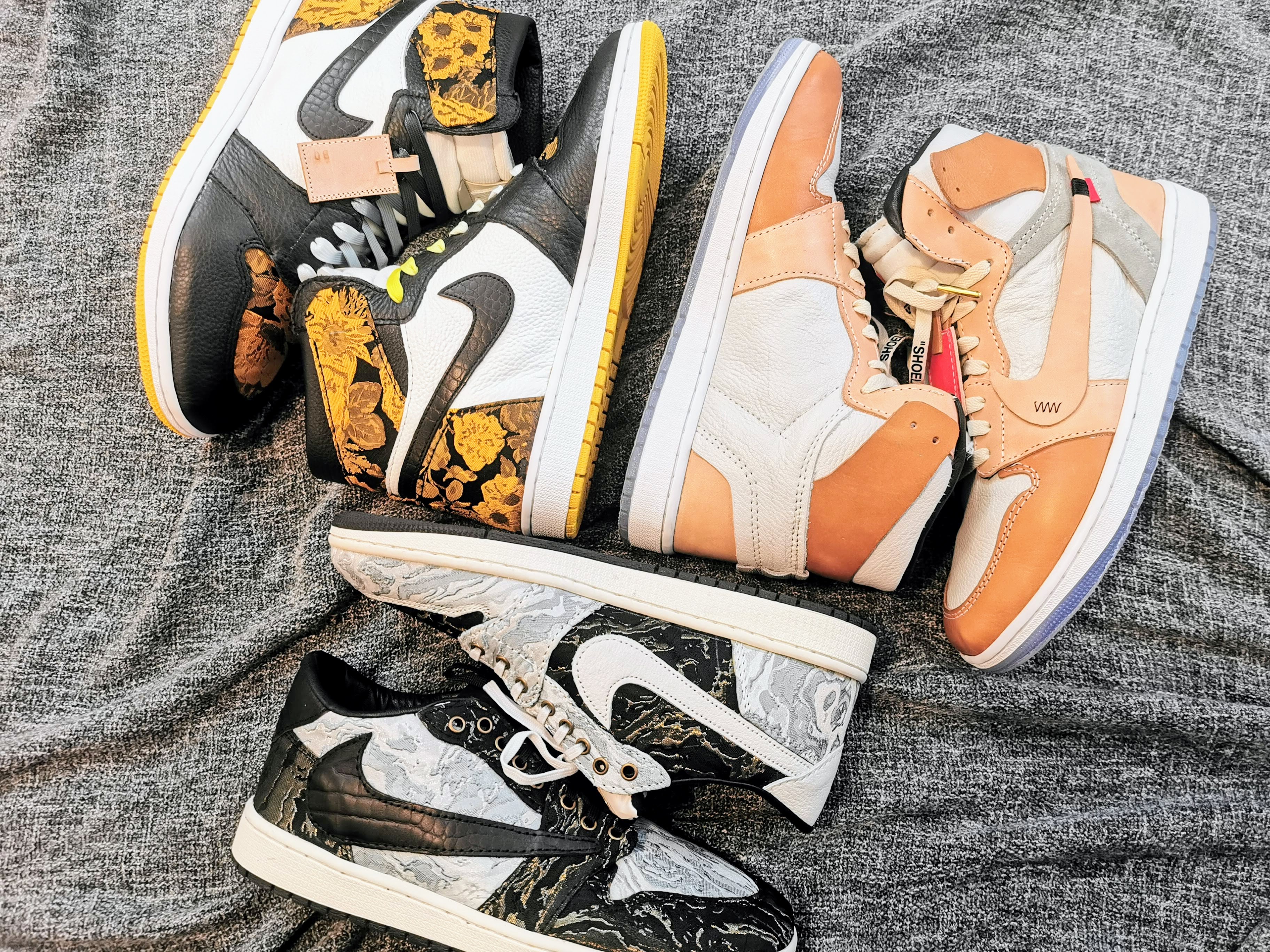 three pairs of designed shoes