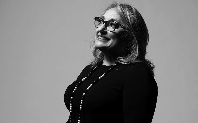 A woman smiling