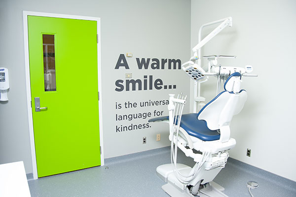 GSC clinic with text on wall that reads: a warm smile is the universal language for kindness