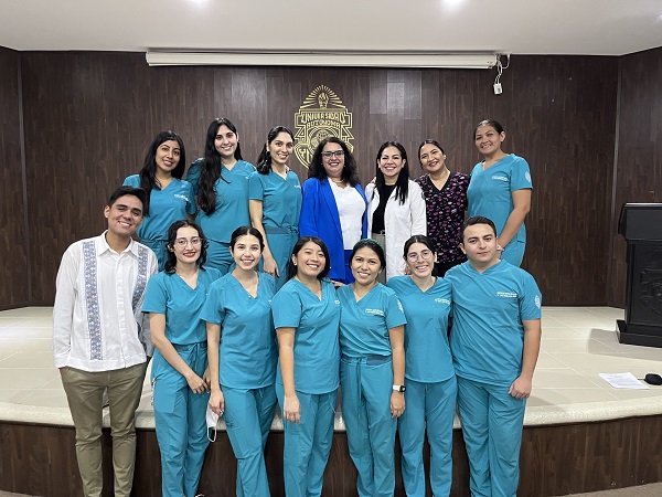 Fabio Arriola (left) PhD student in Dental Public Health, and associate professor Herenia Lawrence (middle in blue jacket) with dental students and faculty members at the Autonomous University of Yucatan in Mexico.