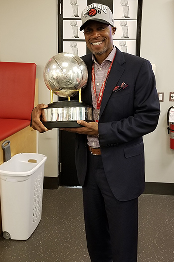 Peter Nkansah holds eastern conference trophy