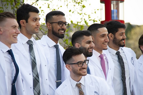 Dentistry students smiling outside