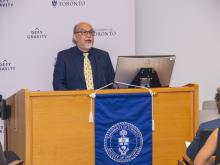 man speaking at podium