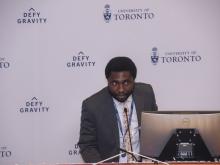 man speaking at podium