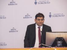 man speaking at podium