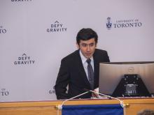 man speaking at podium