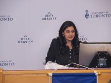 man speaking at podium