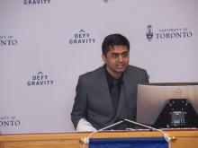 man speaking at podium