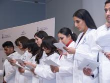students in white coats