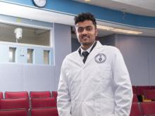 student in white coat