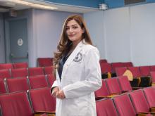student in white coat
