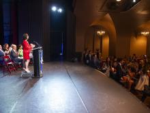 person speaking at podium