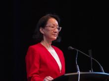 person speaking at podium