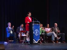person speaking at podium
