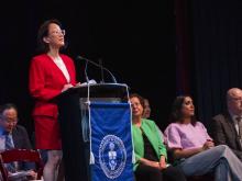 person speaking at podium