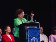person speaking at podium