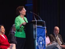 person speaking at podium