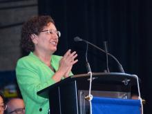 person speaking at podium