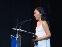 person speaking at podium