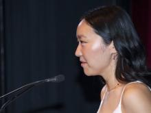 person speaking at podium