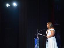 person speaking at podium