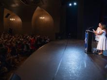 person speaking at podium