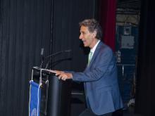 person speaking at podium
