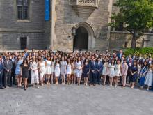 group of students smiling outside