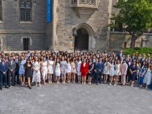 group of students smiling outside