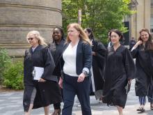 people walking in robes