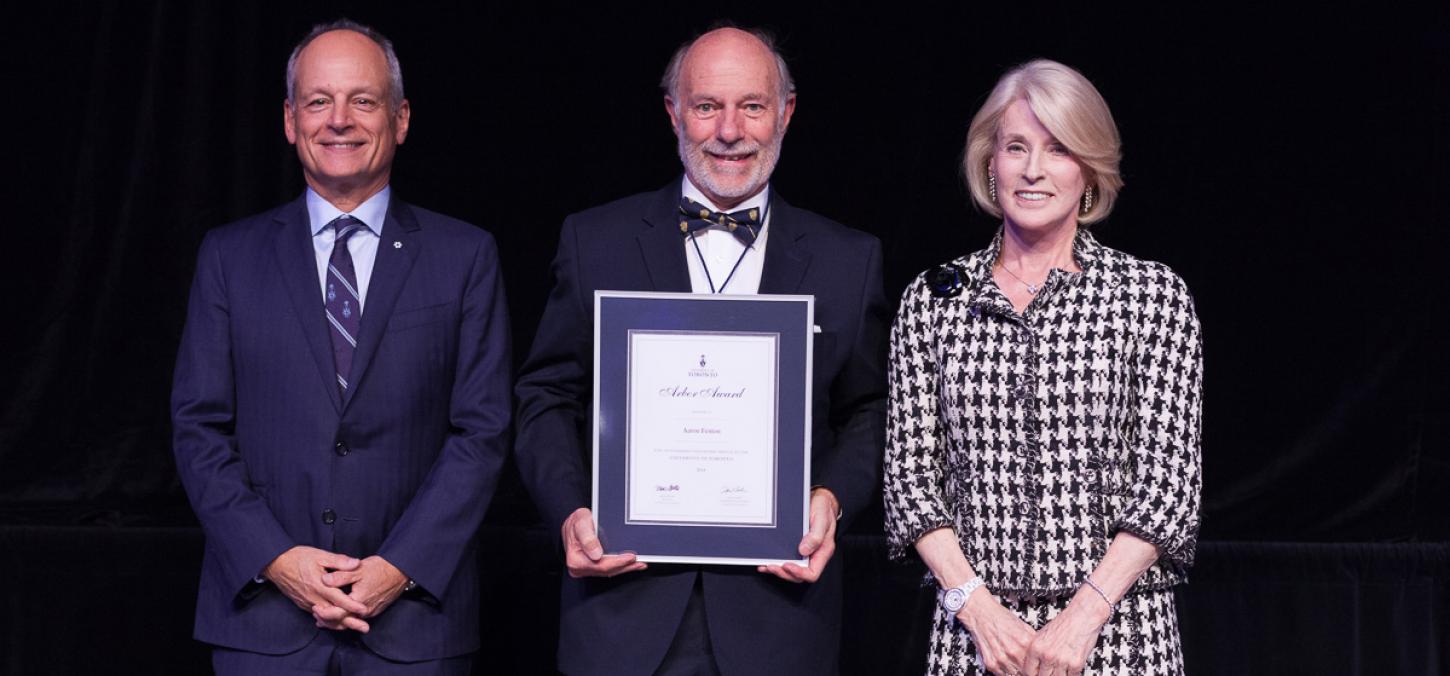 Aaron fenton with UofT President at ceremony