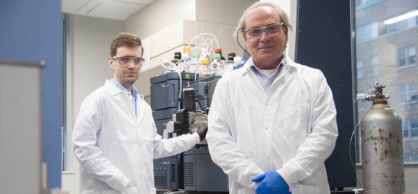 Cameron Stewart with Yoav Finer in lab