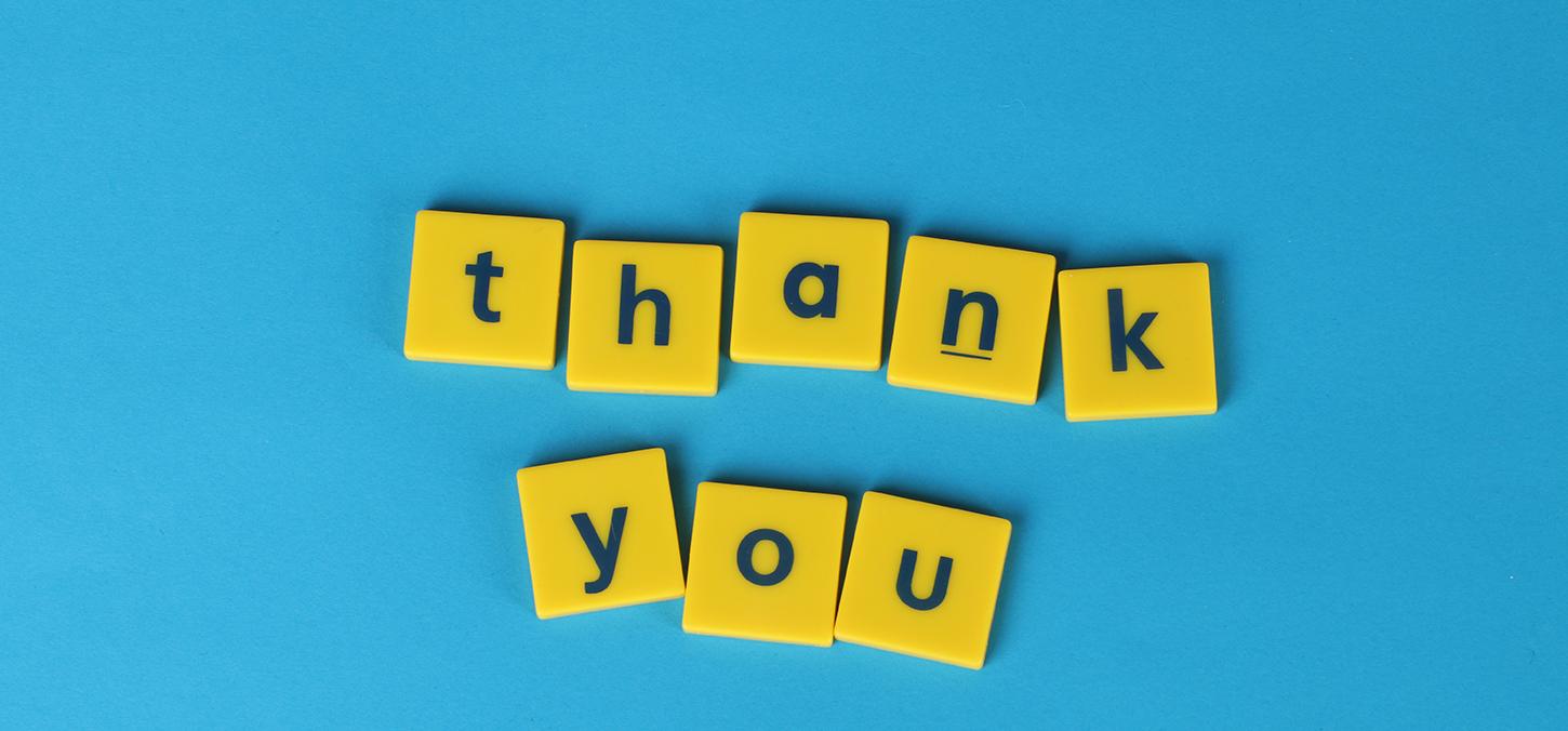 Thank you banner in yellow letters on blue background