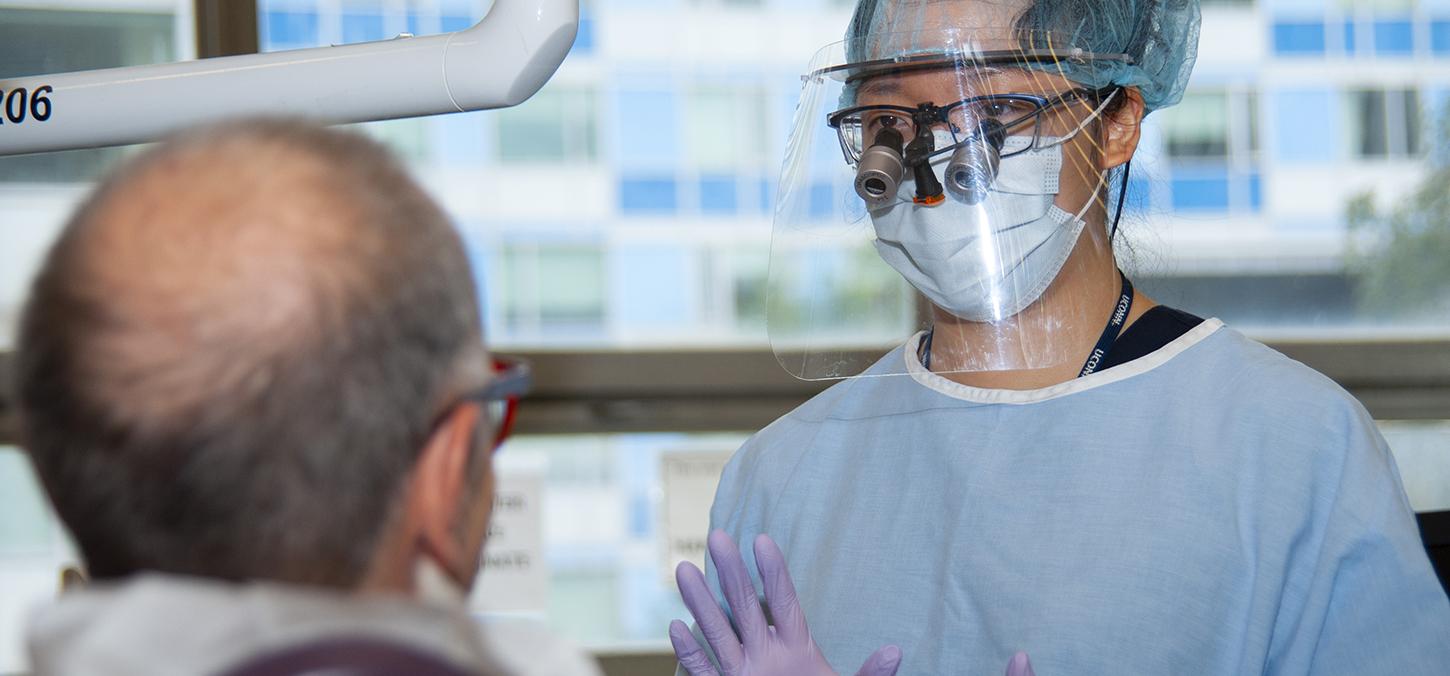 student helping patient