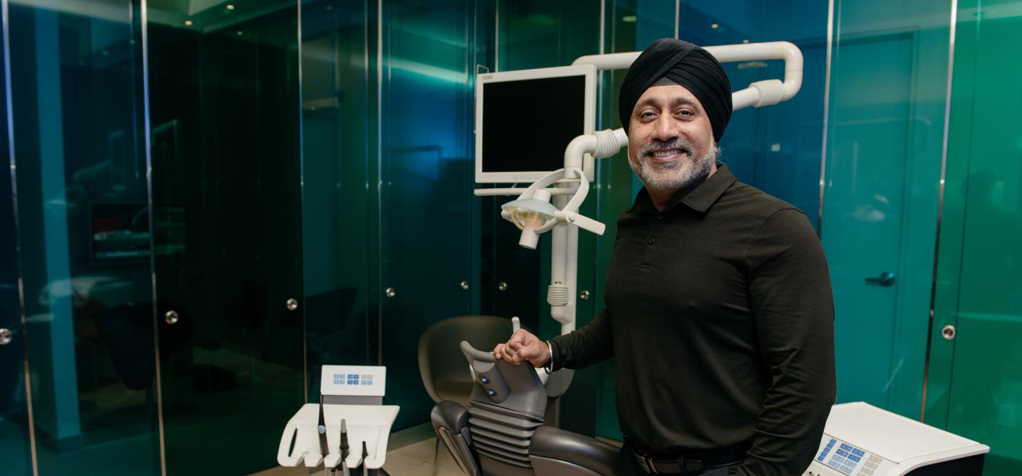 Bobby Chagger in front of dental equipment