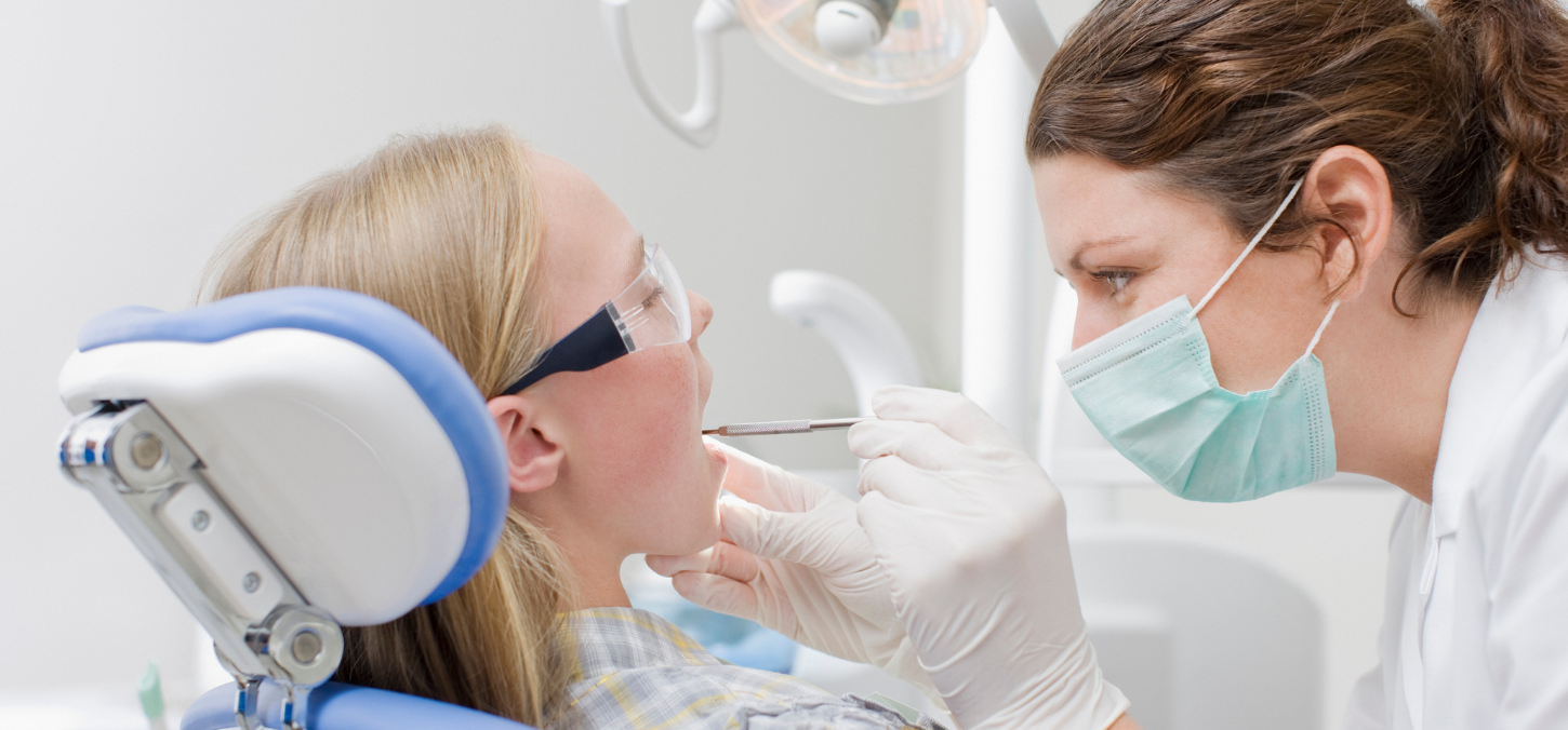 Child getting teeth examined