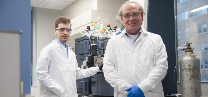 Cameron Stewart with Yoav Finer in lab