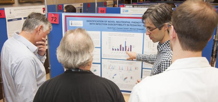 Noah Fine shows his research 