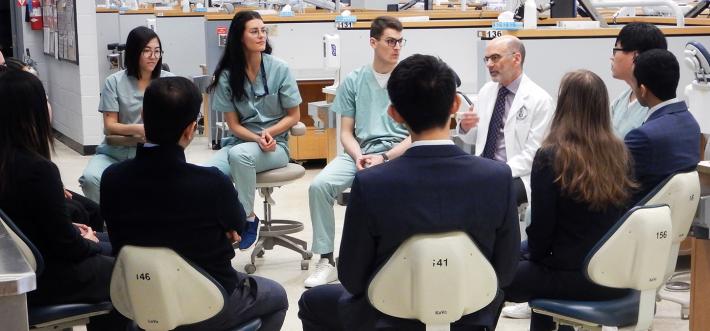 Dean Dan Haas with students and candidates