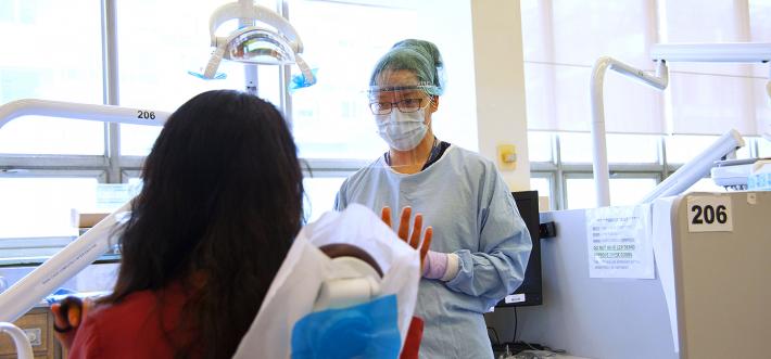 student Rosemary Chu with patient in clinical setting