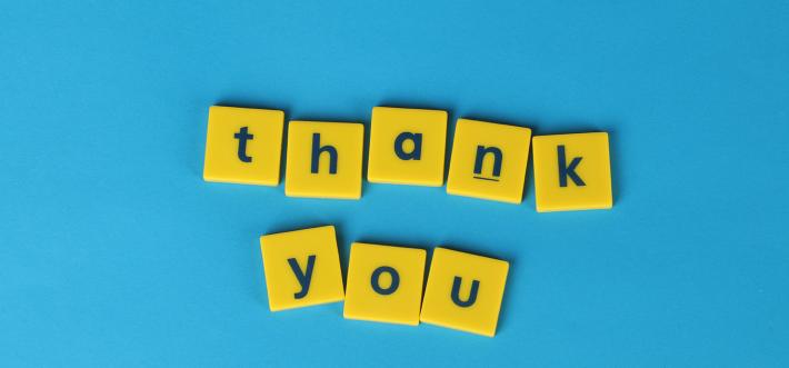 Thank you banner in yellow letters on blue background