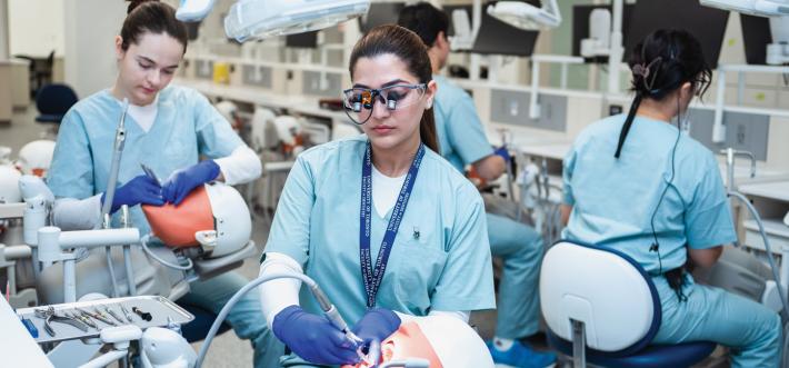 Dr. Lemay and colleagues at a dental exhibition