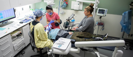 dentists treating special needs patient in dental chair