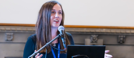Rachael Bosma speaking at a podium