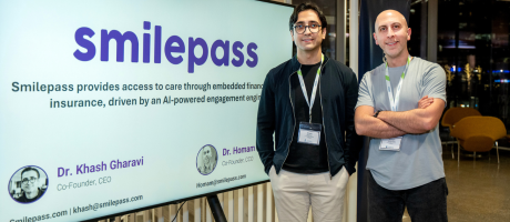 smilepass founders in front of their logo