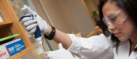 Karina using lab equipment in lab
